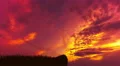 The man stand on the mountain against the background of sunset. Time lapse 4k or 4k+ Resolution