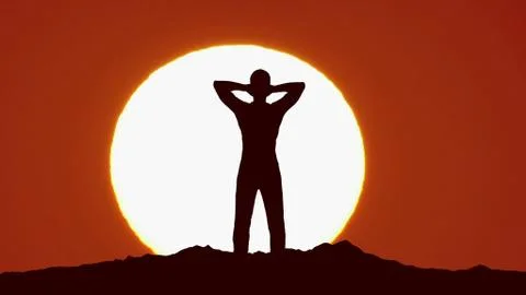 Man stand on the mountain against the background of sunrise. Real time capture イラスト素材