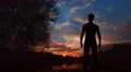The man stand near the lake on the background of sunrise 4k or 4k+ Resolution