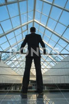 The man stand on the office balcony Stock Photos
