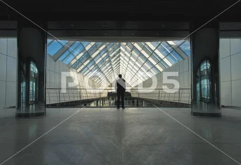 The man stand on office hall near the column Stock Photos