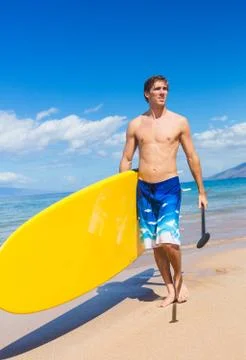 Man with stand up paddle board Stock Photos