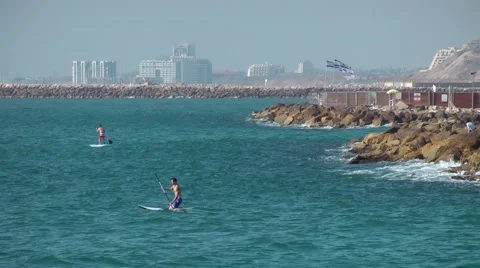 Man stand-up paddle boarding, SUP, on Mediterrin sea in Tel Aviv, Israel Stock Footage 59842985