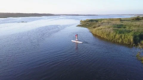 Man stand up paddleboarding Stock Footage 75173004