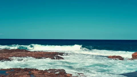 Man stand on pier and take a photo of blue sea waves Stock Footage 211174801