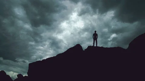 The man stand on the rock on the background of cloud. Time lapse Video stock 64266795