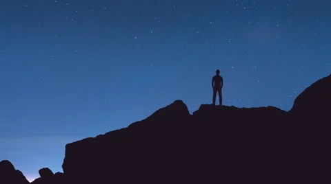 The man stand on the rock on the background of star. Time lapse Stock-Footage 64266911