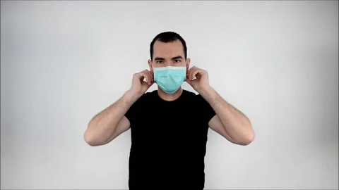 Man stand white background, take of, protect save lifes, closeup. Coronavirus. Stock Footage 134566942