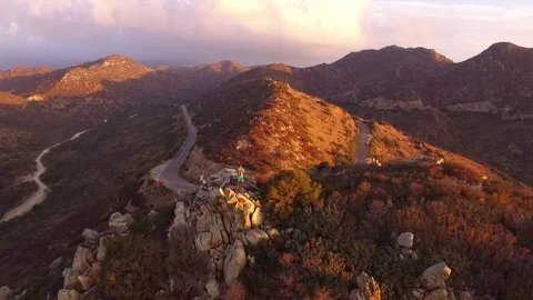 Man standind on the top of the hill during sunrise Stock Footage 82397090