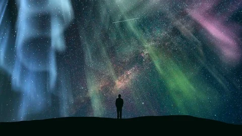 The man standing against the starry sky with the northern light. time lapse Video stock 88655656