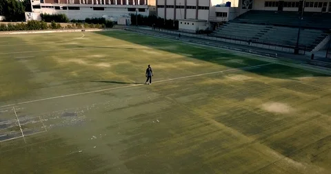 Man standing alone in empty stadium Stock Footage 92240980