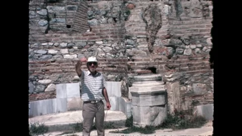 Man Standing by Ancient Wall Stock Footage 277585319