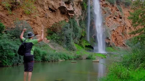 Man is standing and dancing. Hiking in nature. Stock Footage 221932350