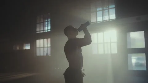Man standing and drinking water 스톡 동영상 236181411
