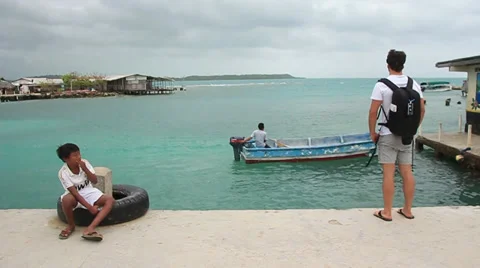 MAN STANDING AND LOOKING FROM A PIER Stock Footage 34391034