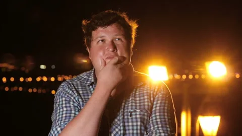 Man standing and thinking about world at night outdoor, portrait Stock Footage 101399295