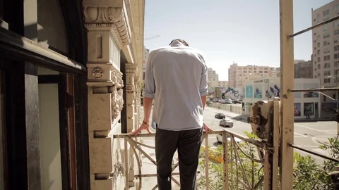 Man standing balcony 01 스톡 동영상 76735047