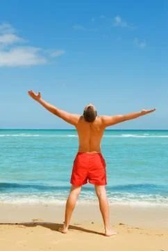Man standing on the beach Stock Photos