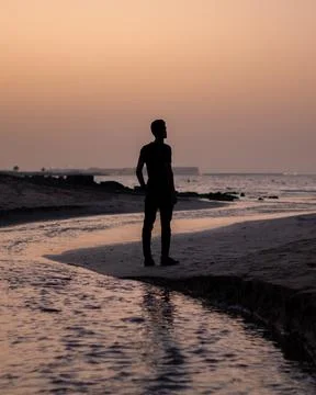 Man standing in a beach Stock Photos