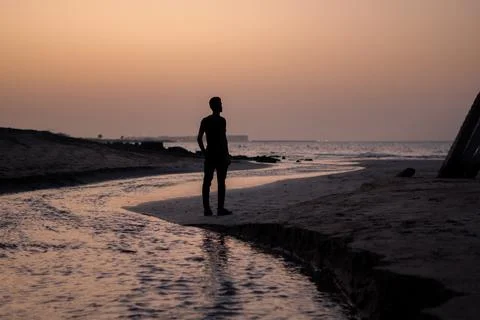 Man standing in a beach Stock Photos