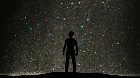 The man standing on a beautiful particles stream background Stock Footage 165282085