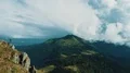 The man standing on the beautiful rock cliff 4k or 4k+ Resolution