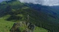 The man standing on the beautiful rock 4k or 4k+ Resolution