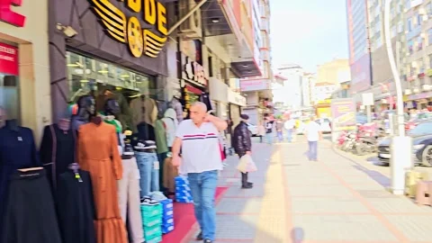 A man is standing behind a counter in a restaurant Stock Footage 272844736
