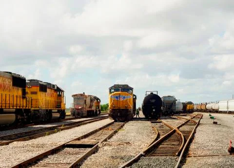 Man standing between the trains Stock Photos
