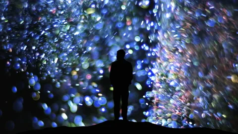 The man standing on a blue shimmering particles background Video stock 165352965