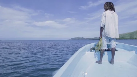 A man standing on a boat Stock Footage 94599811