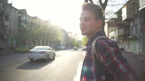 Man standing on the border and waiting to cross the street slow motion Stock Footage 76131328