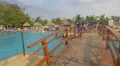 Man standing on the bridge at Playa Blanca Resort, Panama 4k or 4k+ Resolution