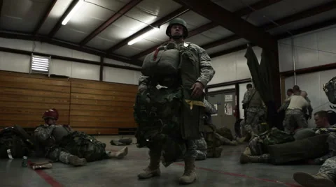 Man Standing in a Building Preparing for Parachute Training Stockbeeldmateriaal 52699825