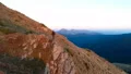 The man standing on the cliff with a picturesque landscape 4k or 4k+ Resolution