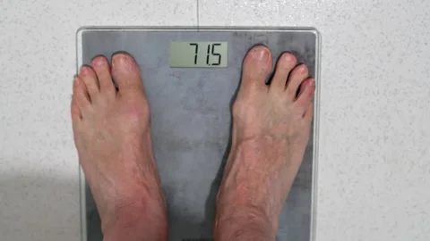 Man Standing On Digital Bathroom Scale Showing Weight Measurement Video stock 331901797
