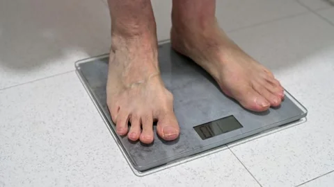 Man Standing On Digital Bathroom Scale S For Health And Fitness Monitoring Video stock 331901911