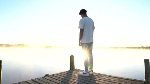 Man standing on a dock 2 Stock Footage 199210503