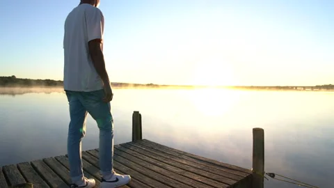 Man standing on a dock 4 Stock Footage 199210927