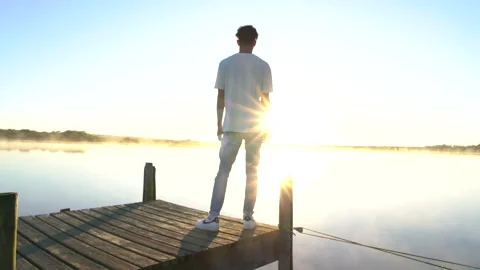 Man standing on a dock 5 Stock Footage 199210802
