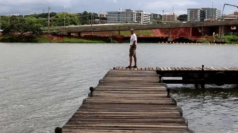 Man Standing on Dock Stock Footage 120881220