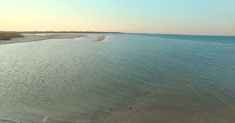 Man standing on the edge of beach and waving Video stock 76201336