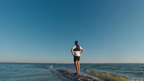 The man is standing on the edge of the Kinburn Spit early morning, Ukraine Stock Footage 269503012
