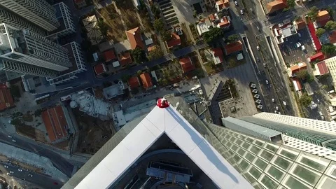 Man standing on the edge of skyscraper Video stock 75317171