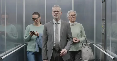 Man standing in the elevator and suffering from headache Stock Footage 306149744