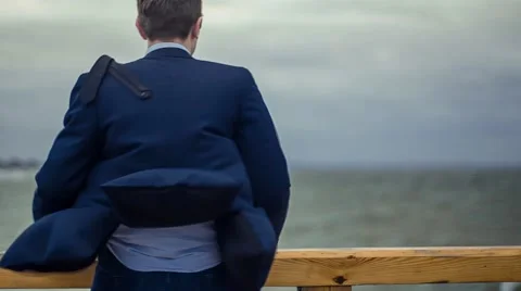 Man standing facing Sea.  Stock Footage 67461141