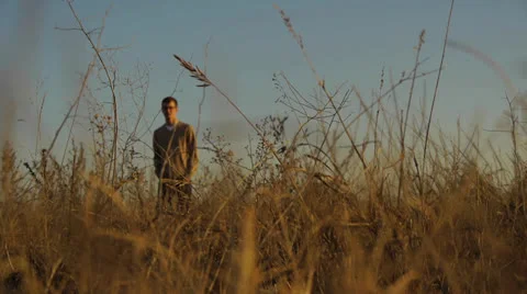 Man Standing in Field Stock-Footage 27130145