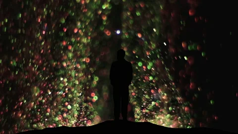 The man standing on a flying shimmering particles background Stock Footage 165352826