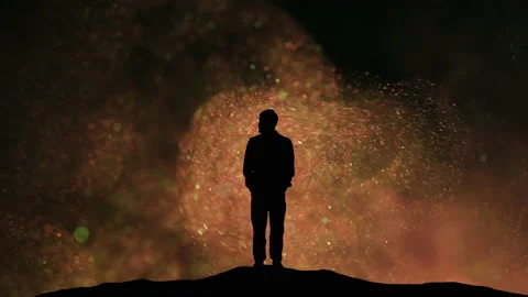 The man standing on a flying shimmering sandy background Video stock 165352940