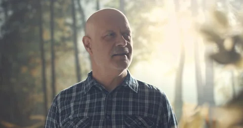 Man standing in a forest and looking around Stock Footage 151160077